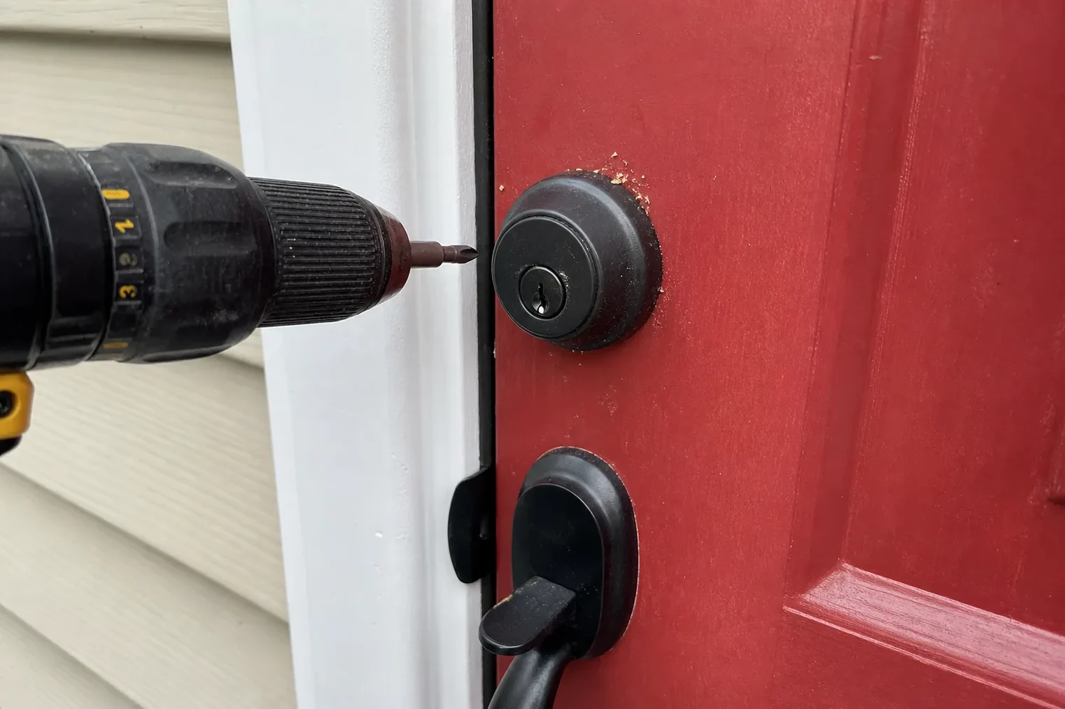 New deadbolt being installed in a front door
